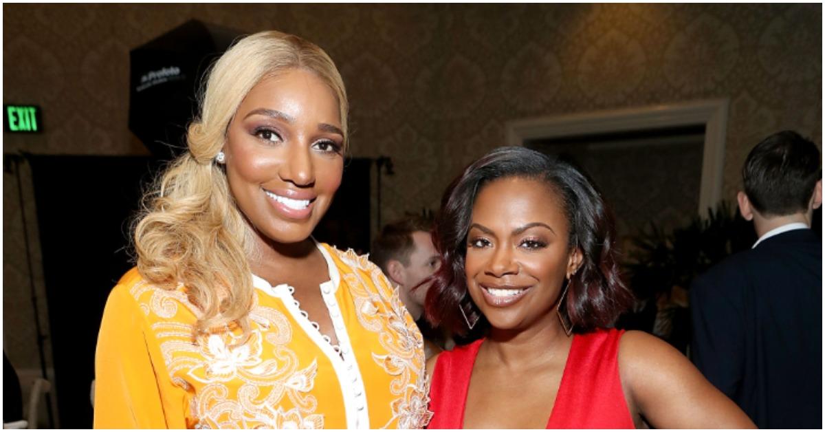 (l-r): NeNe Leakes and Kandi Burruss smiling at an event. 