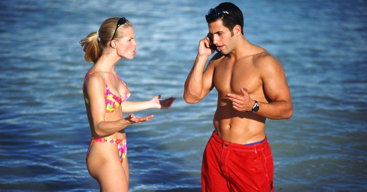 A couple argues on the beach