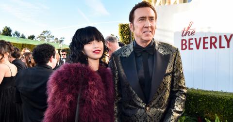 Nicolas Cage and his spouse, Riko Shibata, at the 81st Golden Globe Awards.