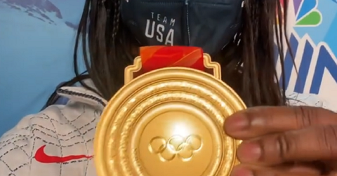 Erin Jackson displaying her Winter Olympics 2022 Gold medal