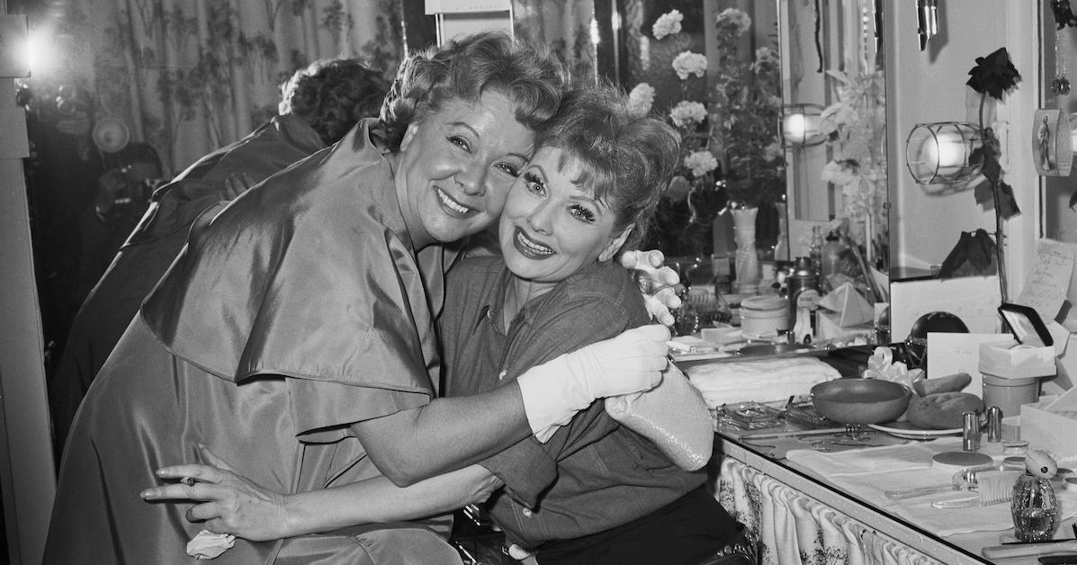 Vivian Vance and Lucille Ball hugging in a dressing room