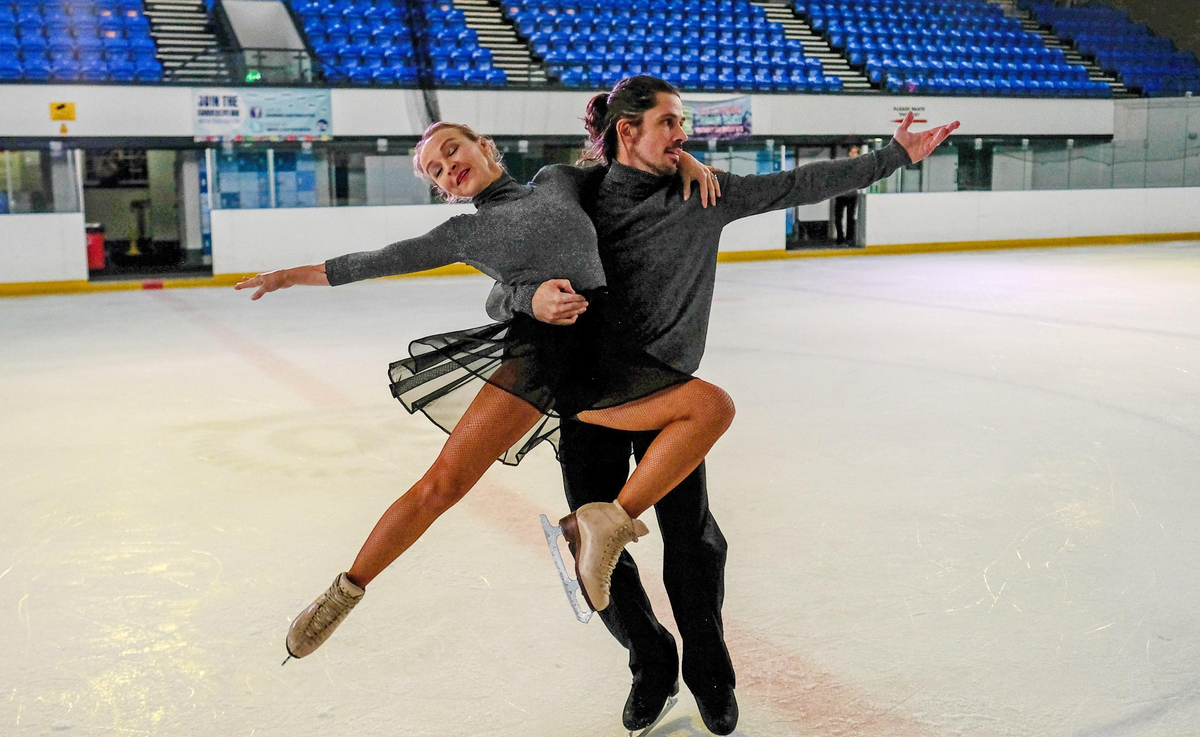 Pair skaters practicing for their event.