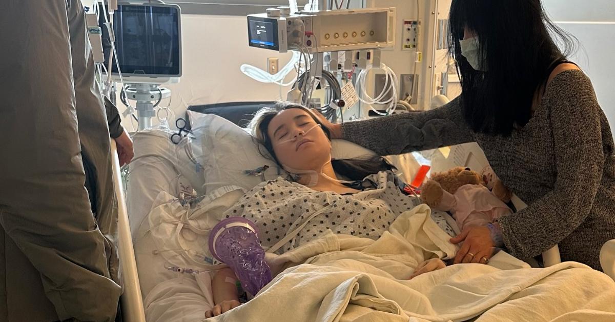 Lil Tay rests in her hospital bed following open-heart surgery.