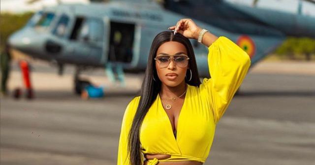 Quad in a yellow shirt near a helicopter