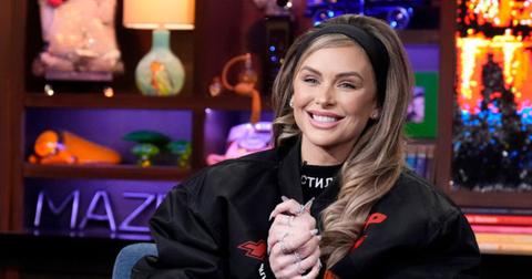 Lala Kent seated and smiling with hands clasped on 'WWHL'