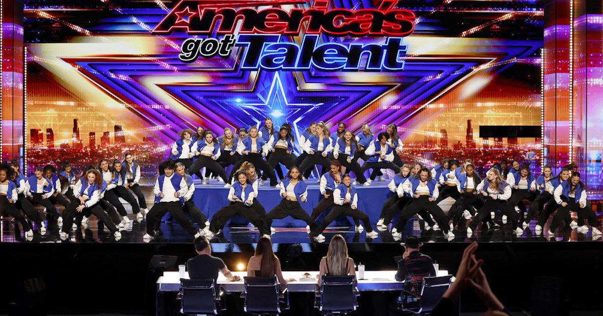 The judges watch a group perform on 'America's Got Talent'