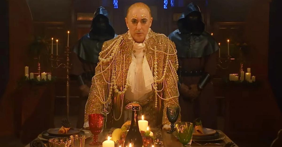 Alan Cumming talks to the faithfuls in The Traitors.