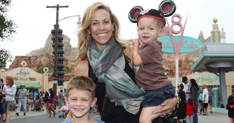 Sheryl Crow and her sons pose at Cars Land in Disney California Adventure park