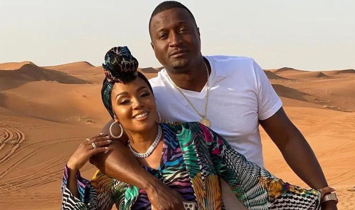 Rasheeda and Kirk pose in a desert