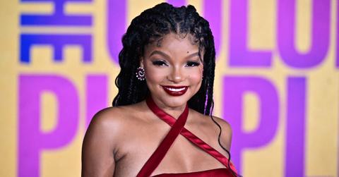 Halle Bailey attends 'The Color Purple' premiere in a flowing red dress.