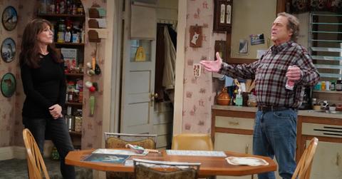 Dan and Louise talking in the kitchen on 'The Conners'.