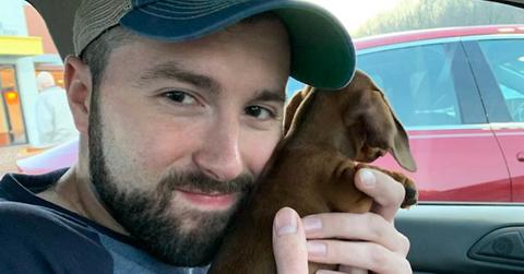 Matt Napolitano cuddling with a dog