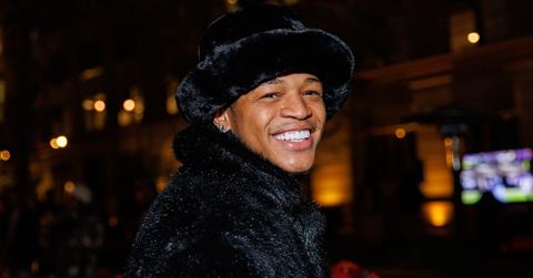 Yk Osiris in a fur hat and coat.