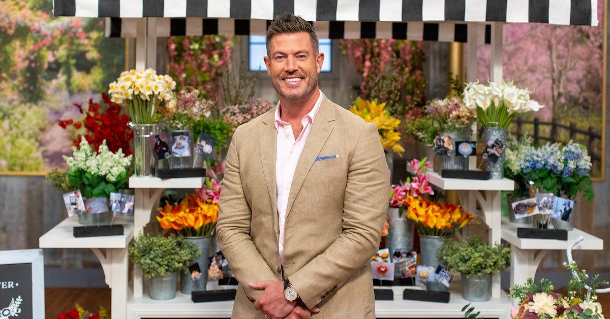 'Spring Baking Championship' host Jesse Palmer smiles and poses in a stylish tan suit jacket paired with a light pink button-up shirt.