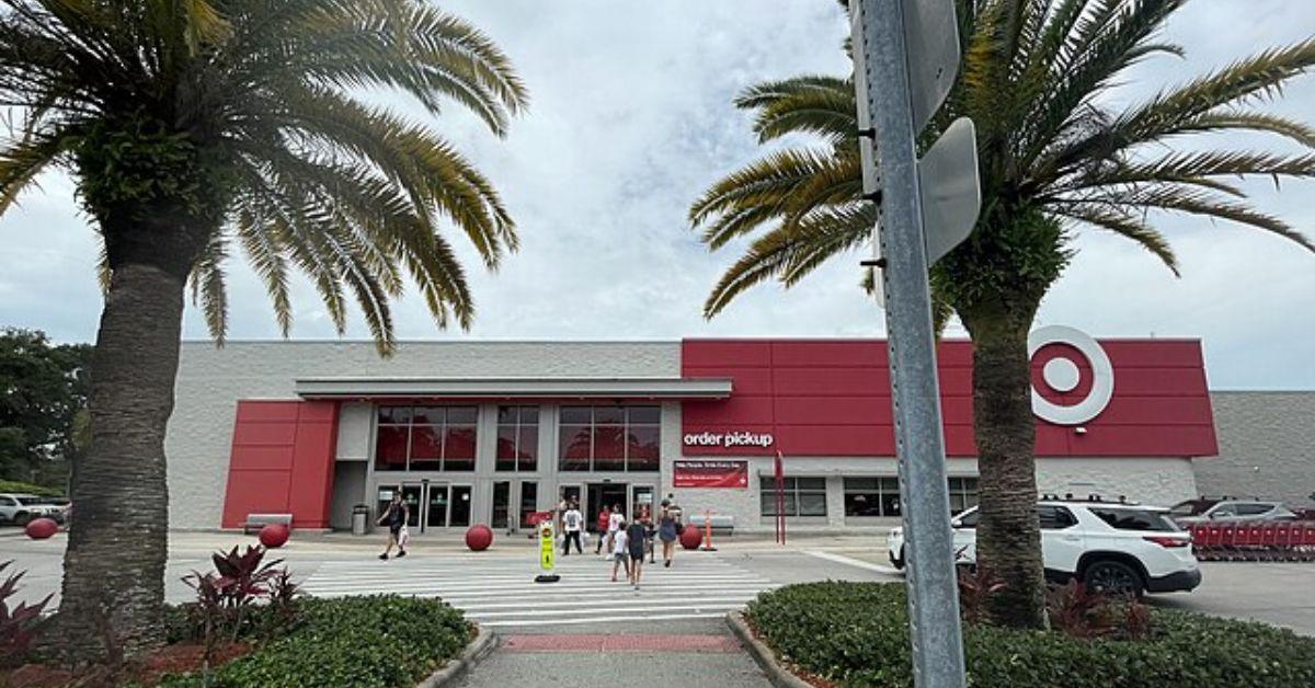 A Target storefront framed by palm trees. 