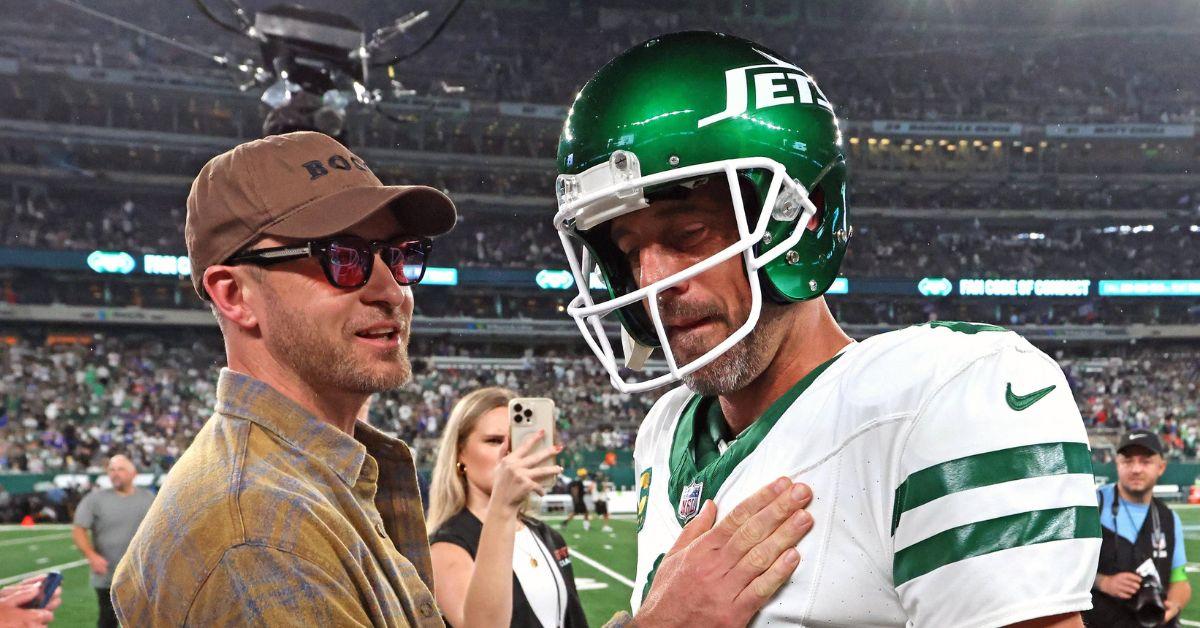 Justin Timblerake and Aaron Rodgers on the sideline ahead of a Jets game. 