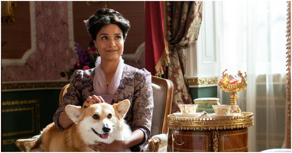 Shelley Conn as Lady Mary Sharma petting her Corgi, Newton in 'Bridgerton'