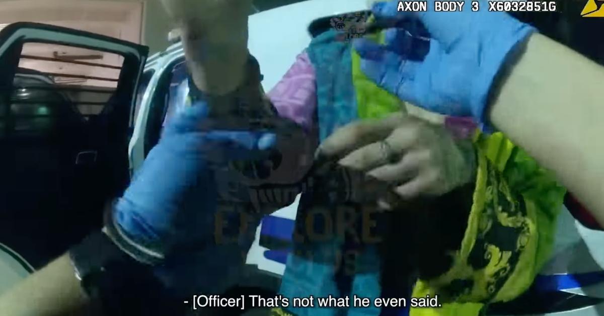 A screenshot of Icy Wyatt having his cuffs removed 