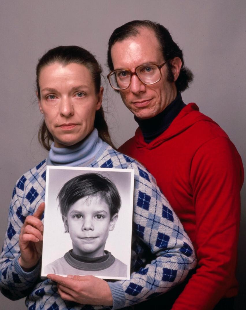Etan Patz's parents holding his picture.
