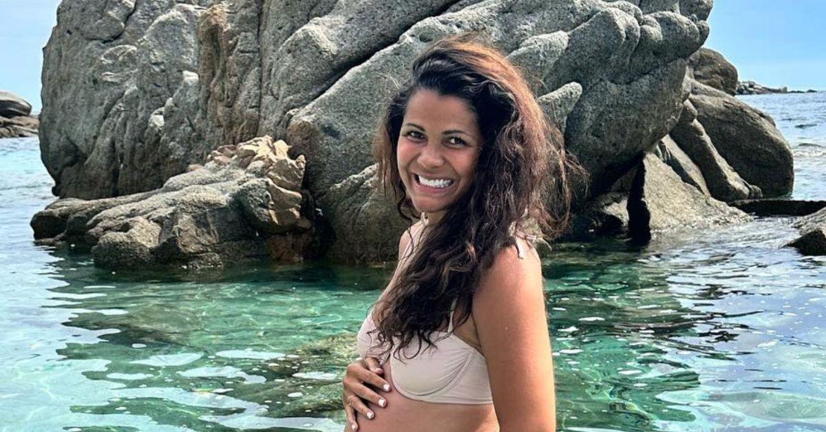 Jen Bush shows off her baby bump in the water