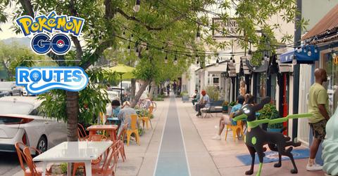 'Pokémon GO' promo art showing a street and a Zygarde on a leash.