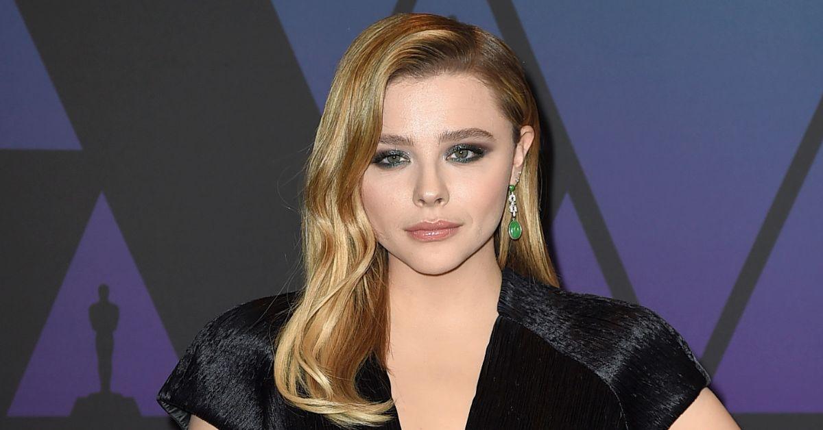 The kid behind Chloe Grace Moretz looks like a man in his 30's : r/funny