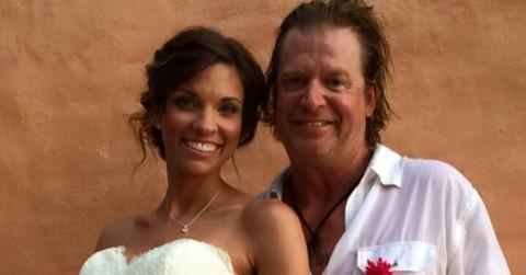 Kristen and Charlie Robison posing together on their wedding day