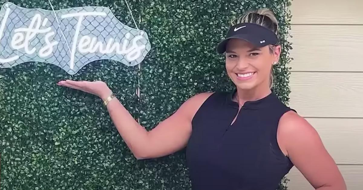 Lindsay Shiver poses in front of a sign that reads Let's Tennis