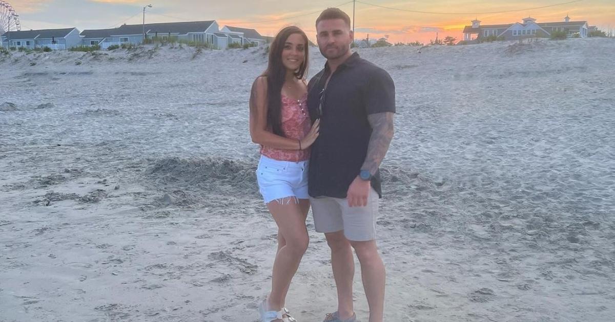 Sammi with fiance Justin on a beach