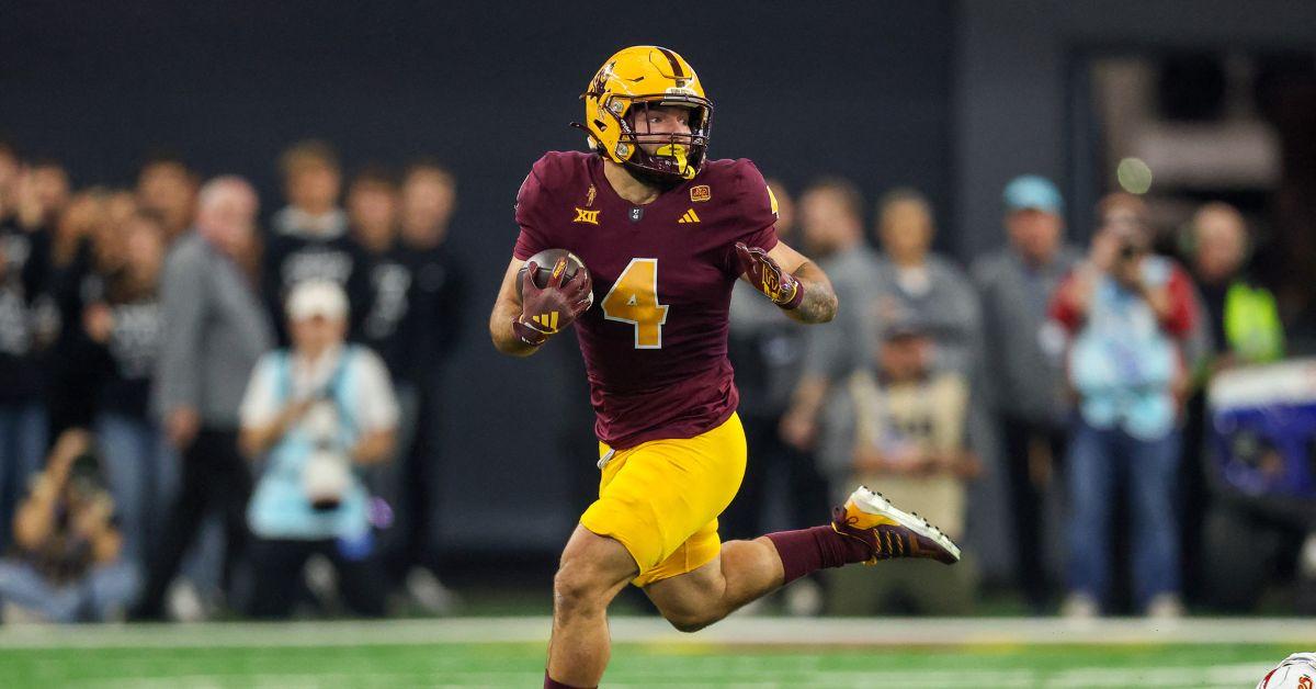 Cam Skattebo running at the Big 12 Championship. 