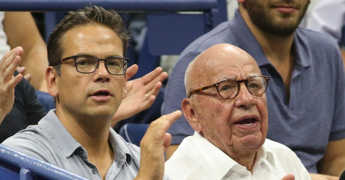 Rupert Murdoch and his son Lachlan Murdoch (left) attend the quarter-final match of countryman John Millman vs. Djokovic.