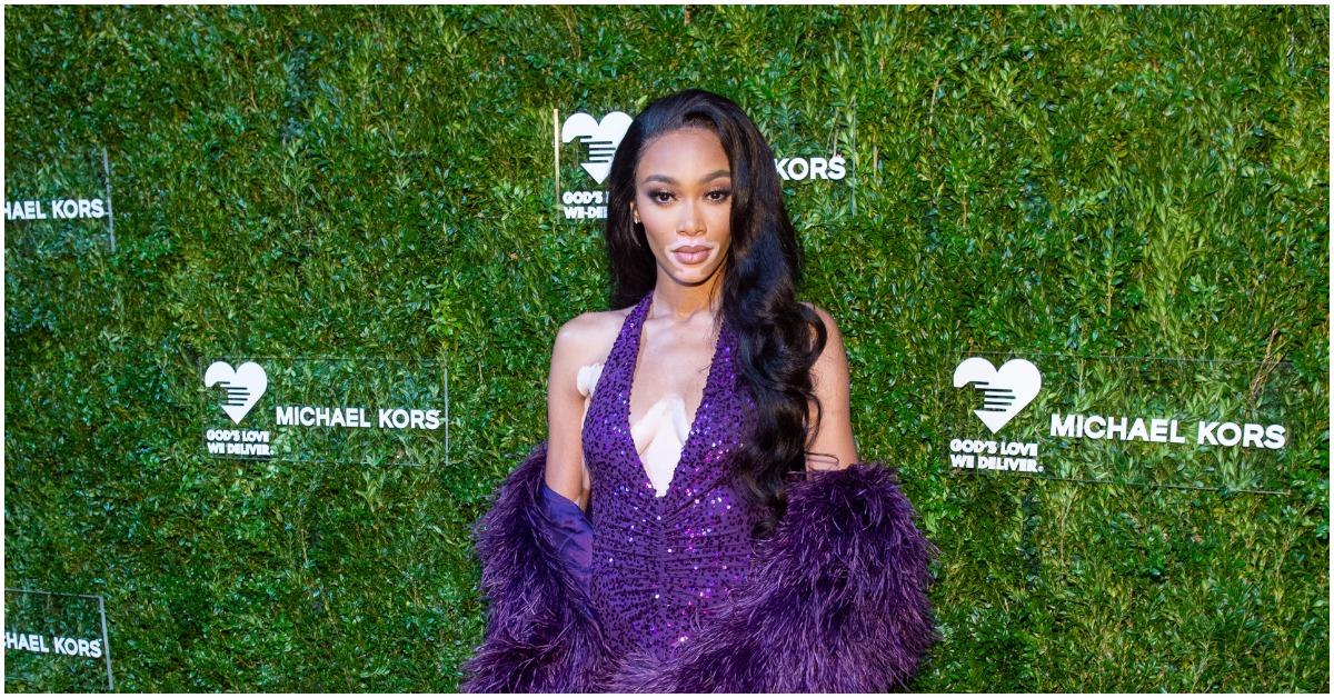 Winnie Harlow attending an event and posing for the camera.