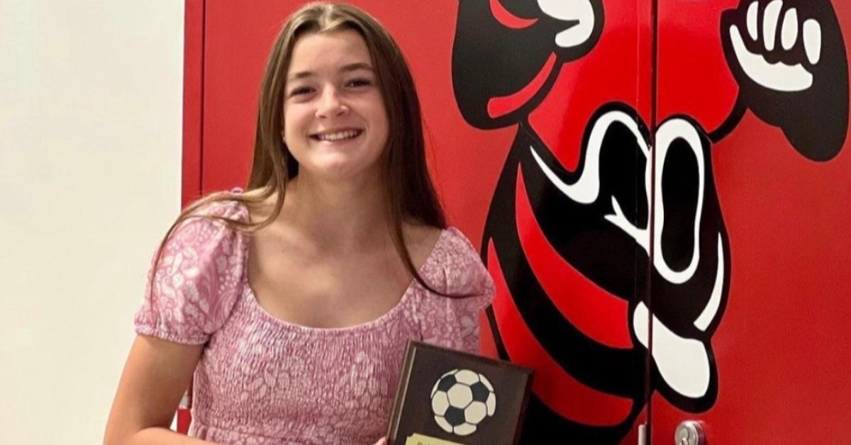 Ava Wood poses with an award for soccer