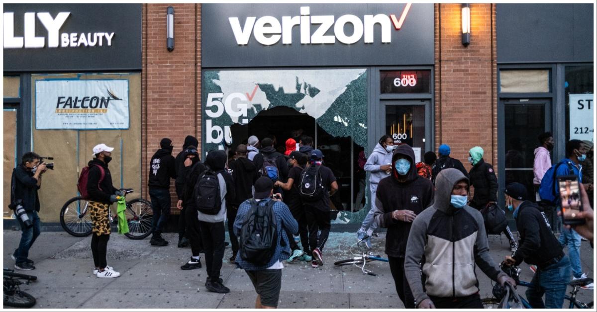 People loot a Verizon store in New York City in 2020. 