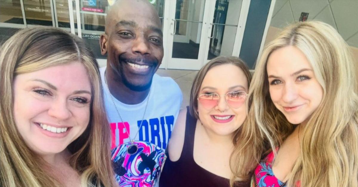 Davis family from 'Seeking Sister Wife' poses for a selfie while exploring the world together.