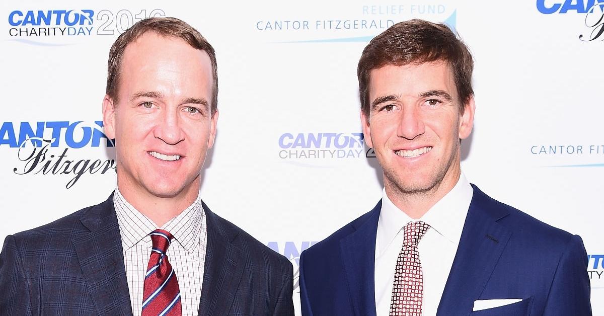 Peyton Manning and Eli Manning attend the Annual Charity Day 