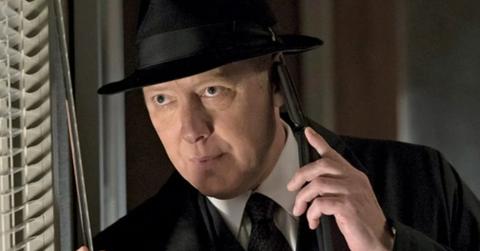 Red is taling with someone on the phone.