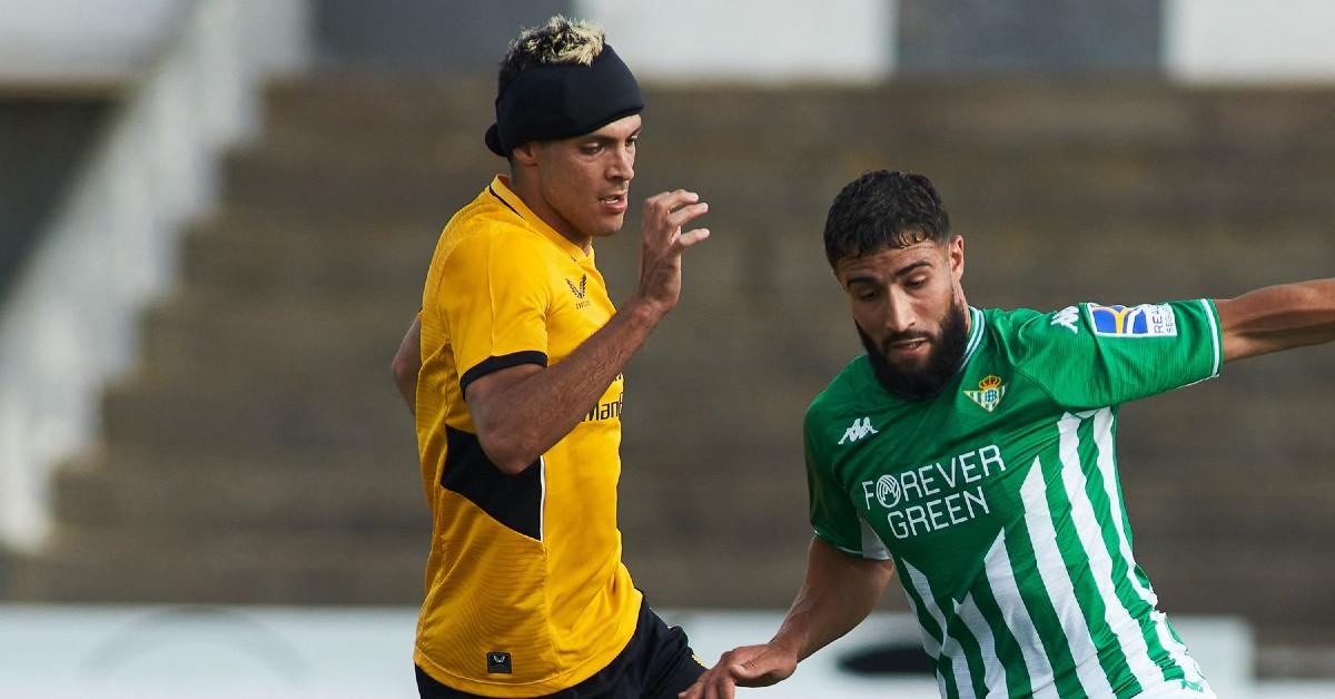 Raul Jimenez of Wolves, Nabil Fekir of Real Betis in action during the football friendly match
