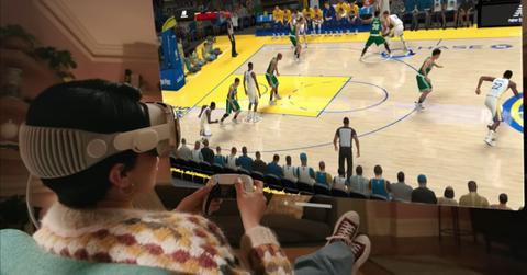 A person playing NBA 2K23 with Apple Vision Pro.
