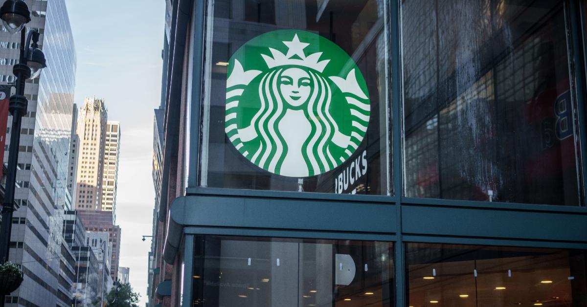 A Starbucks sign outside of a New York City location