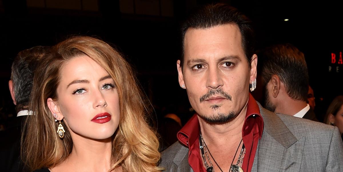 Amber Heard and Johnny Depp walk the red carpet red carpet at the 2015 Toronto International Film Festival.