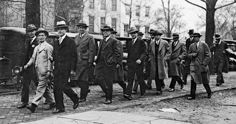 The jury members of the Teapot Dome Trial trying oilman Harry Sinclair for fraud are escorted by US Marshals on their way to lunch to avoid another mistrial, Washington DC, April 10, 1928