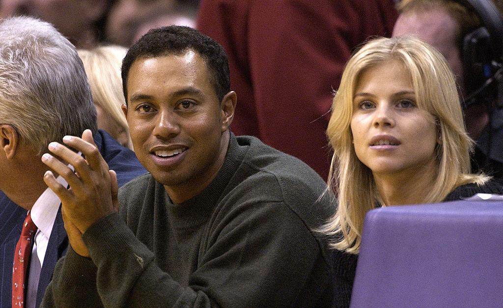 Tiger Woods and Elin Nordegren attend basketball game.
