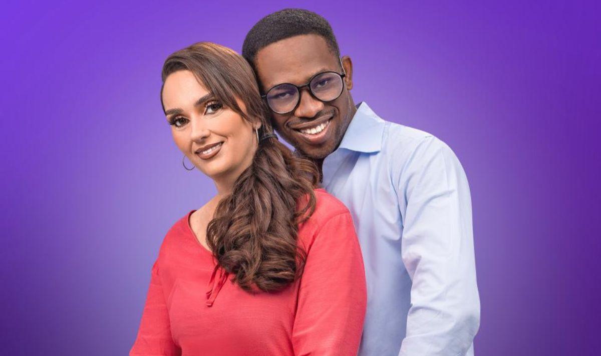 Rayne and Chidi pose close to each other against a purple background