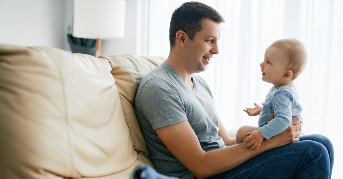 Happy father and son bonding while spending time together at home