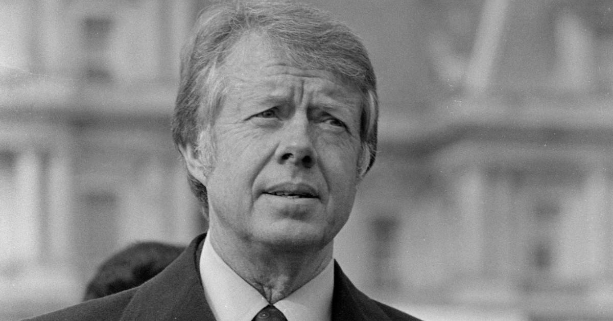 Old black and white photo of Jimmy Carter addressing a crowd