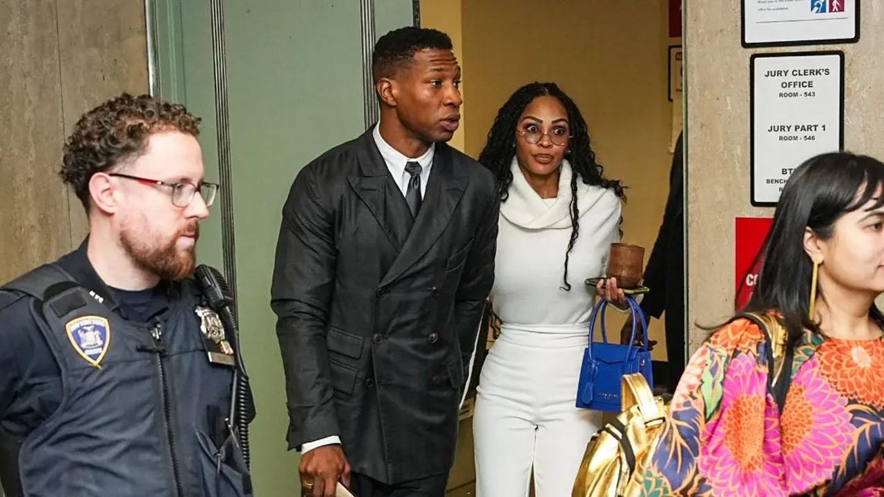 Jonathan Majors and his girlfriend, Meagan Good, arrive for closing arguments on Dec. 15, 2023
