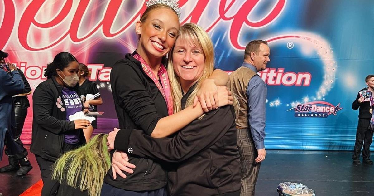 Kimberly Rishi hugs one of her dancers