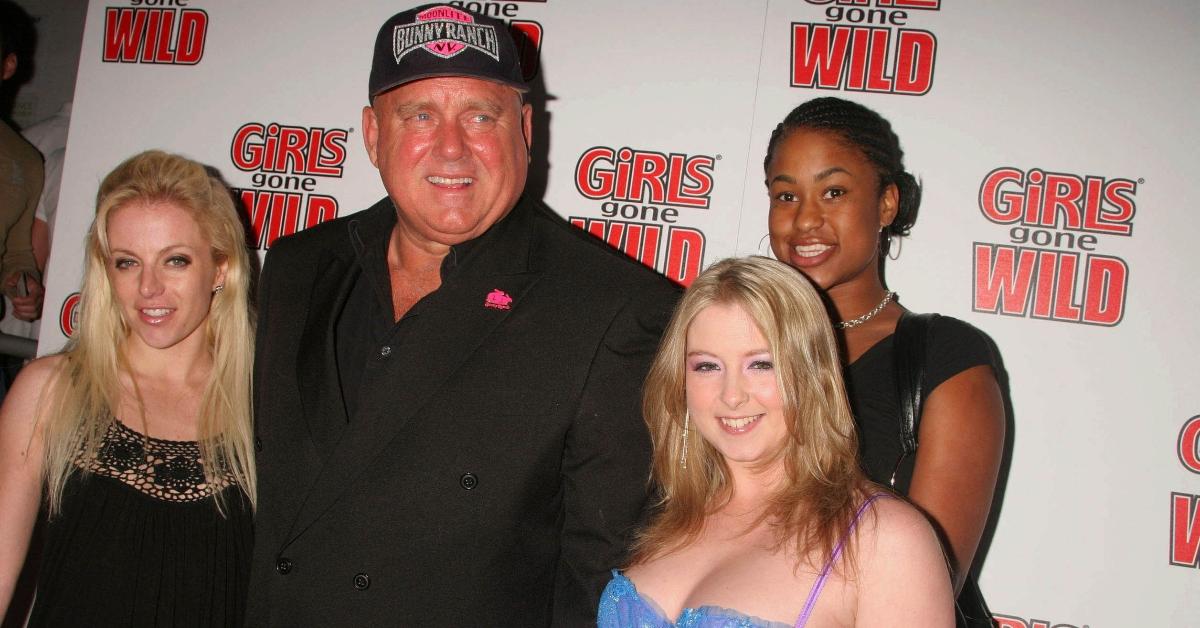 Dennis Hof with women from the Bunny Ranch