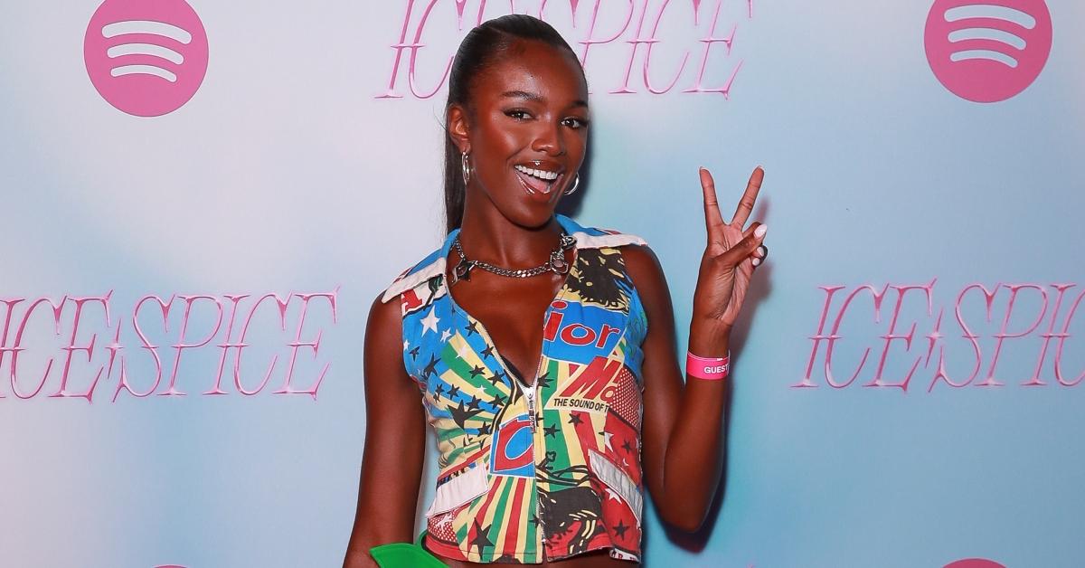 Leomie Anderson smiles and holds up a peace sign at the Spotify x Ice Spice Afterparty at Cirque Le Soir.